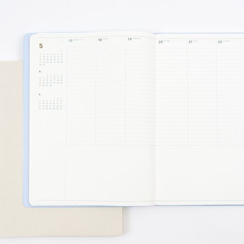 A detailed July layout shows stickers, notes, and decorative marks used across the generous weekly boxes.