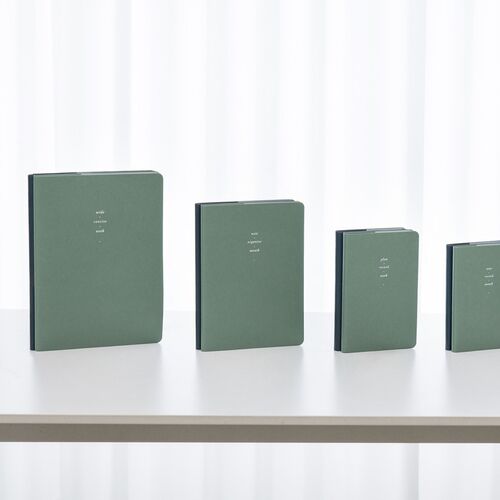 Midnight Navy planners are grouped by size, displaying the coordinated cover finish and centered white lettering.