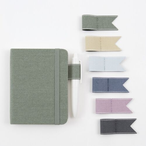 Modern Navy planners and a yearly wall-style calendar create a coordinated planning display with pencils nearby.