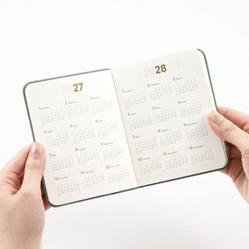 The planner opens to a yearly overview with 2027 and 2028 calendar information printed across both pages.