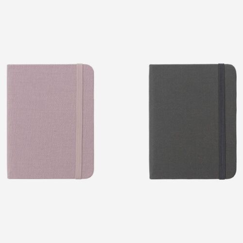 Muted Pink and Storm Gray planners are displayed together with their coordinated elastic bands.