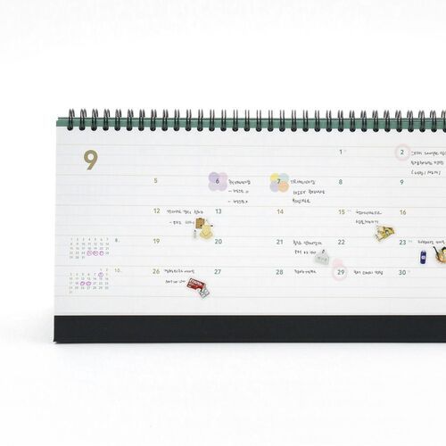 A September weekly page displays colorful stickers, handwritten reminders, and a small month reference calendar.