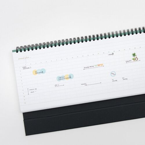 A weekly planning page includes handwritten notes, numbered dates, and small colorful illustrations across the lined layout.