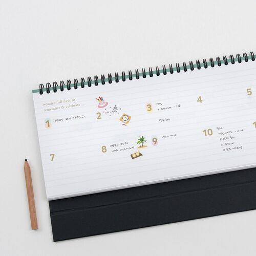 A close view shows a page being turned over the lined writing area beneath the wire binding.