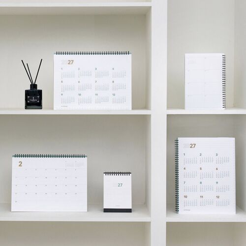 Pastel geometric stationery rests on the translucent cover, making its clear PP material and mint border easy to see.