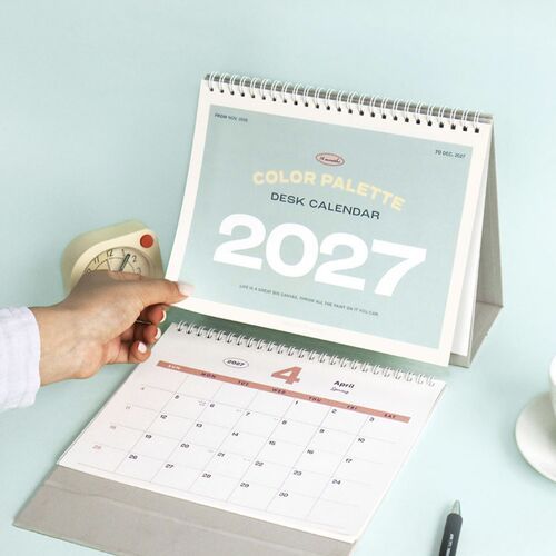 A close view of the March page shows the large month number, open date grid, and mustard-colored weekday header.