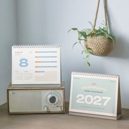 A July page and the reverse-side layout appear together, showing colorful date bars and additional planning space.