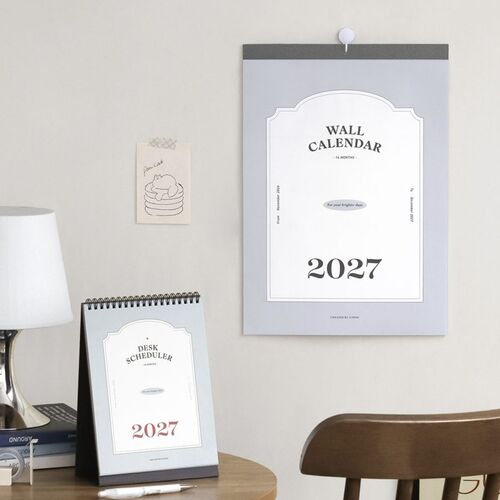 The pale blue cover and black base coordinate neatly with the neutral bedroom setting.