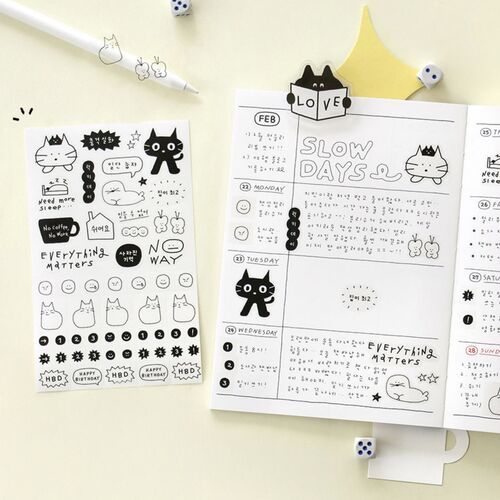 The Pastel Yellow cover appears beside an open calendar and stationery, highlighting the cheerful cat-and-star illustration.