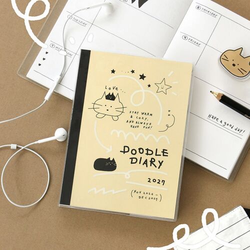The Soft Blue planner is displayed against window blinds, with black cat illustrations and white decorative lines.