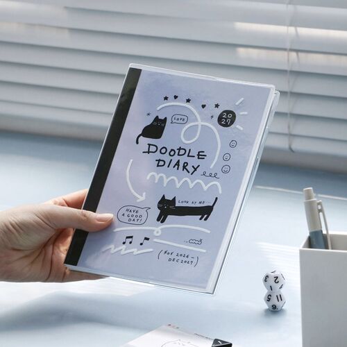 A photo-journaling spread shows a meal photograph, handwritten notes, and doodled borders for recording memories.