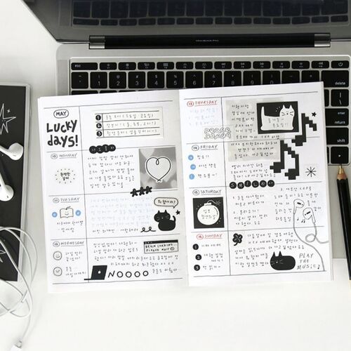 A close-up of the monthly pages shows mini calendars, decorative date markers, and the included bookmark designs.