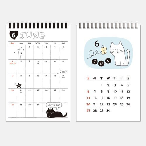 Photo 5: June features a white cat and butterfly on a pale blue panel beside a spacious dated planning grid.