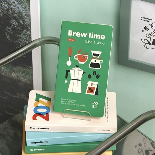 Four planners are displayed with elastic bands, showing how the covers look when secured closed.