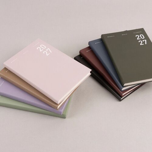 Ash Purple and Sage Green covers sit open and closed, highlighting the simple white 2027 cover lettering.