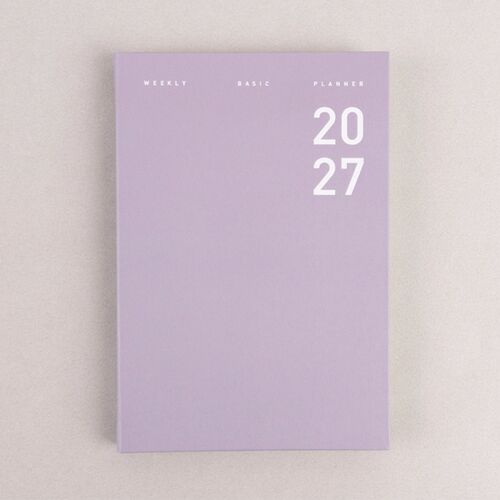A stack of Sand Pink, Hazel, Ash Purple, and Sage Green planners shows their hardcover thickness.