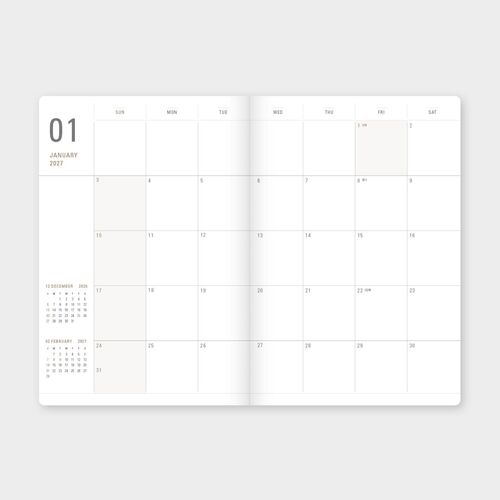 A yearly plan spread organizes all twelve months in a single lined overview for broad scheduling.