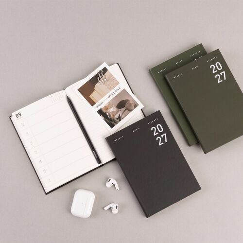 The January weekly spread provides large dated sections on the left and lined notes on the right.